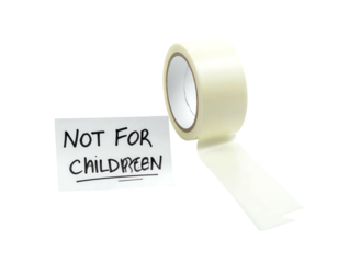 A roll of tan masking tape unwinds next to a handwritten note on a white rectangle. Black background