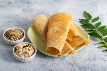 Bajra dosa is a healthy South Indian crepe made from pearl millet, crisp outside, soft inside, rich in fiber and nutrients.
