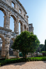 Fototapeta premium Part of the amphitheater with trees in Pula, Croatia