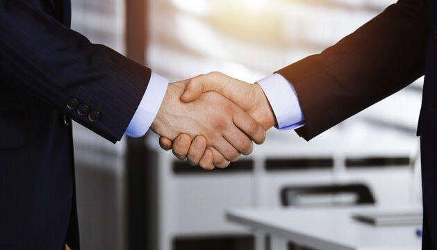 businessmen handshake - business meeting and partnership concept copy space
