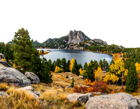 A serene mountain lake surrounded by autumn foliage, rocky terrain, and evergreen trees