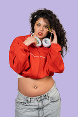 Confident gen z woman talking on phone with headphones