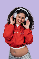 Happy woman enjoying music wearing headphones