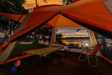 Camping tent, view from inside the tent to see the view outside the mountain, forest, lake, camping tent on a high mountain