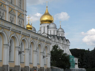 Kremlin palace arcade and golden onion domes in Moscow