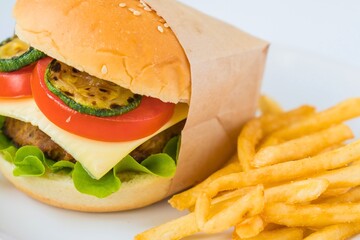 Delicious burger with fresh toppings and golden french fries