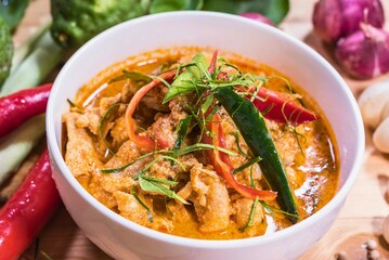 Delicious thai red curry with chicken and fresh herbs
