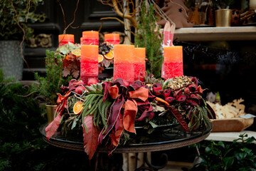 Candles, red ribbons, and fir branche