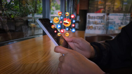 Smartphone with Floating Social Media Reactions in Cafe Setting