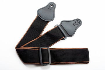 Black fabric strap for electric or acoustic guitar.