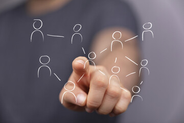 Hand pointing at network diagram.  Teamwork, connection, communication, collaboration, social media, global network, business, technology,