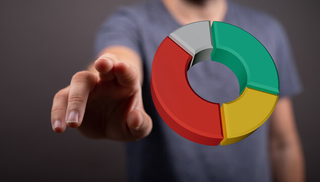 Person pointing at colorful pie chart. Concept of business, data, finance, investment, analysis, market, and success. Suitable for articles or p