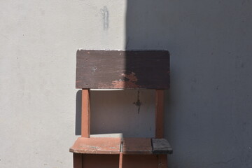 Abstract Minimalist Composition of Chair, Light, and Shadow on a Wall