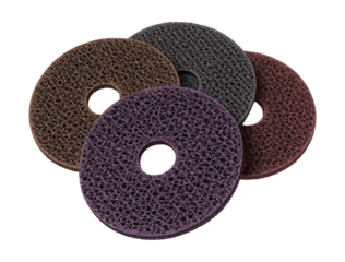 Nylon mesh abrasive discs for efficient paint removal on job sites.