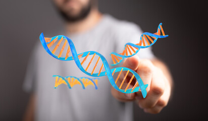 High-quality image of a person interacting with a 3D model of a DNA strand. Perfect for science,...