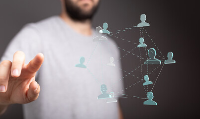 A man's hand interacting with a visual representation of a social network, symbolizing connections, communication, and community.