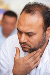 Obraz premium portrait of single Egyptian Arab man thinking, sited outdoors at a terrace