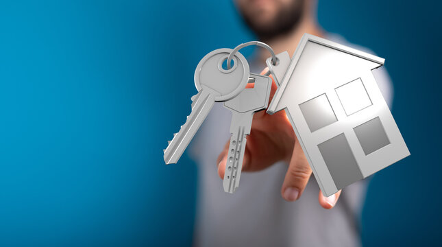 A person's hand holding house keys and a house model symbolizing homeownership, real estate and property investment. Blue background. Modern con
