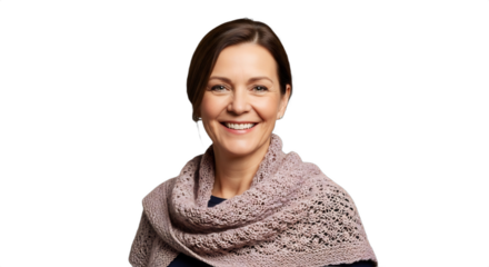 Smiling 58-63-year-old Caucasian woman, a professional knitter, showcasing a complex hand-knitted shawl. Ideal for winter market ads, artisan features, holiday gift guides,