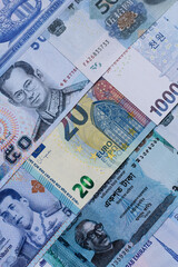 Money background, currency, paper banknotes from different countries. Money cash currency, blue
