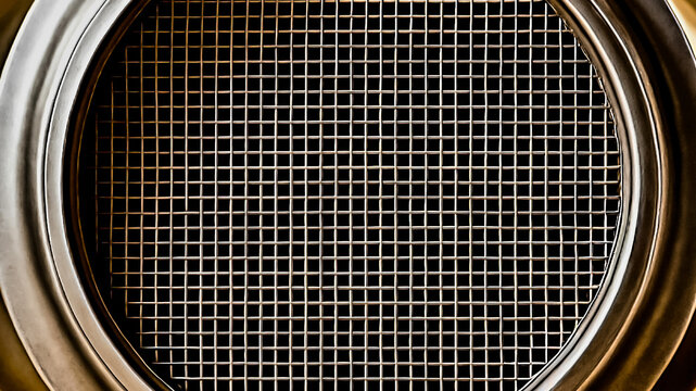 close-up shot of the internal structure of a catalytic converter, a component used in vehicle exhaust systems. abstract honeycomb pattern automotive background .