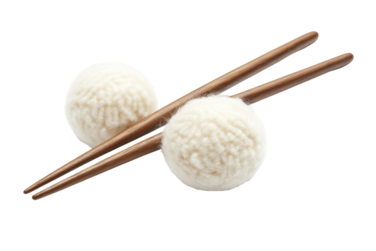 White mochi balls with wooden chopsticks isolated on transparent background. Handcrafted yarn needles with balls isolated on white background.