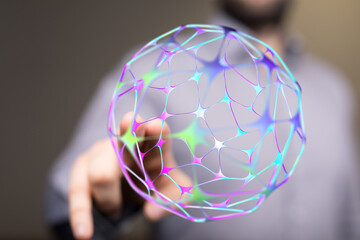 Abstract image of a person interacting with a futuristic network sphere. Represents technology, communication, and interconnectedness
