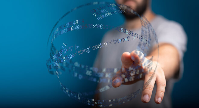 Man reaching towards a glowing digital globe symbolizing modern technology, data, internet, and communication in a futuristic concept