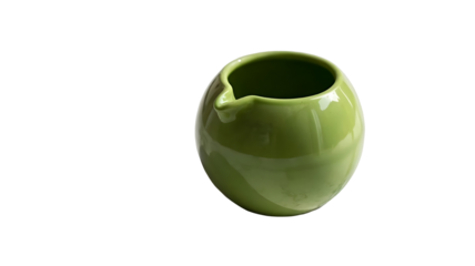 Transparent png of a green ceramic creamer pitcher with a spout on a plain setting adding a touch of elegance to any table –real image , without background –isolated on transparent background.