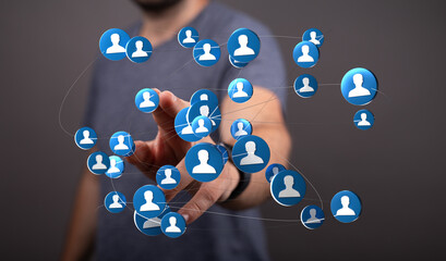 Visual representation of digital networking and online connections. Hand interacting with a network of digital profiles, showing global communic