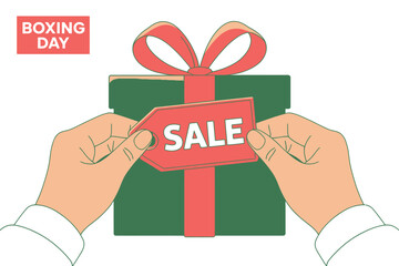 Hands holding a gift box with a "SALE" tag for Boxing Day