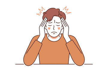 A person holds their head in their hands, experiencing a headache or migraine.