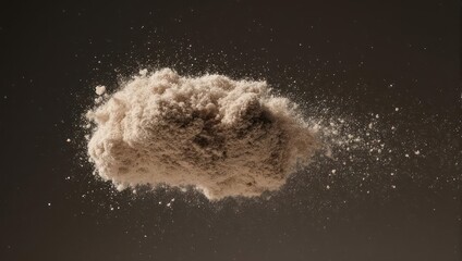 Dust explosion against a dark background, creating a dynamic and abstract effect.