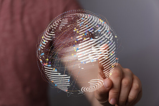 Abstract image showing network data connected to world globe, tech hand touching digital earth concept for communication worldwide wi
