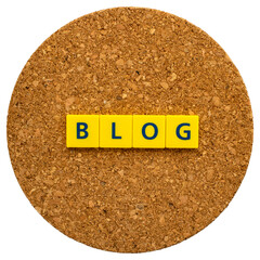 "BLOG" written in letter blocks on a cork board