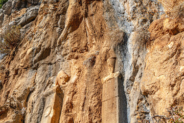 The scenic views of the rock reliefs in Elmalı, Antalya, Turkey