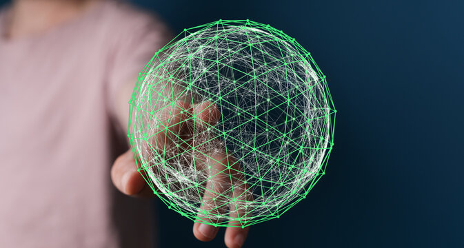 Concept of global network and connections. Person holds a glowing green digital sphere, representing communication and the internet. Ideal for t