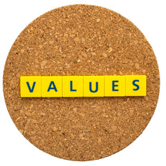 "VALUES" written in letter blocks on a cork board