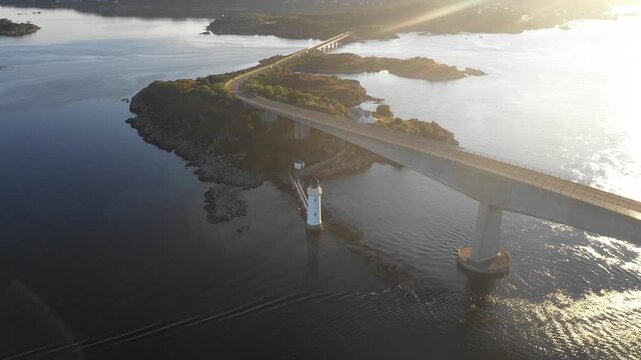 Aerial view of lighthouse near Skye Bridge and Isle of Skye at sunrise