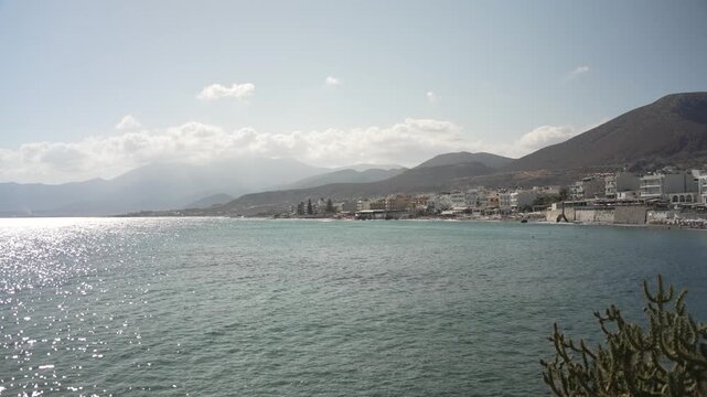 View of sea, coastline and Paralia Limena Chersonisou Beach in Limenas Chersonisou, Crete, Greek Islands, Greece, Europe