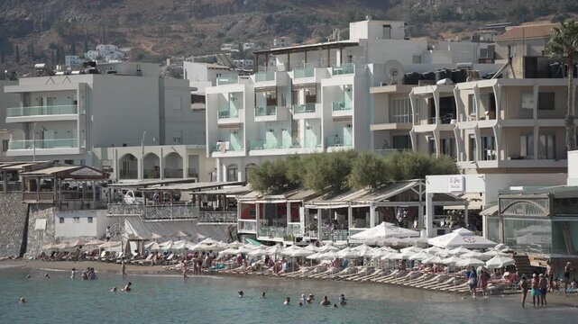 View of sea, hotels and Paralia Limena Chersonisou Beach in Limenas Chersonisou, Crete, Greek Islands, Greece, Europe
