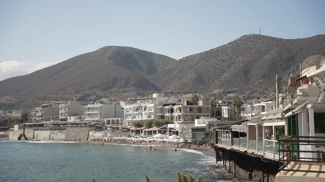 View of sea, coastline and Paralia Limena Chersonisou Beach in Limenas Chersonisou, Crete, Greek Islands, Greece, Europe