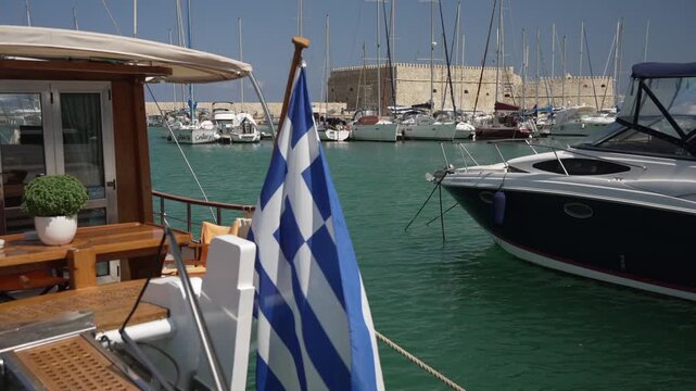 View of boats in Heraklion Venetian Port and Venetian Fortress Rocca a Mare on a sunny day, Heraklion, Crete, Greek Islands, Greece, Europe