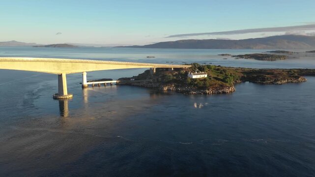 Aerial view of Skye Bridge and Isle of Skye at sunrise on a sunny day in Scotland