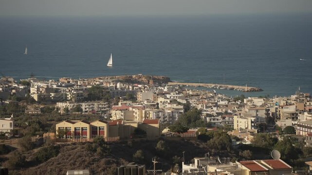 View of Limenas Chersonisou from Piskopiano village on a sunny day, Piskopiano, Crete, Greek Islands, Greece, Europe