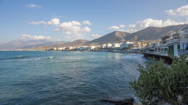 Time lapse of sea, clouds and Limenas Chersonisou on a sunny day, Limenas Chersonisou, Crete, Greek Islands, Greece, Europe
