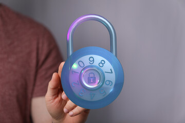 Secure digital lock representing data protection and cybersecurity. Hand holding a digital...