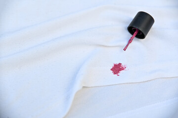 dirty pink cosmetic stain on white shirt in daily life. stain for cleaning concept.