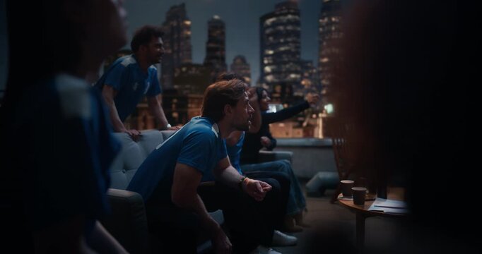 Friends Gather on a Rooftop to Watch a Championship Match. They Enjoy Sports and Entertainment Together, Cheering and Celebrating, Happy about Their Team Victory - Powered by Adobe
