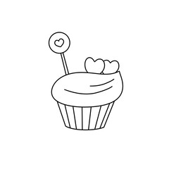 A cupcake with a heart shaped candy on top